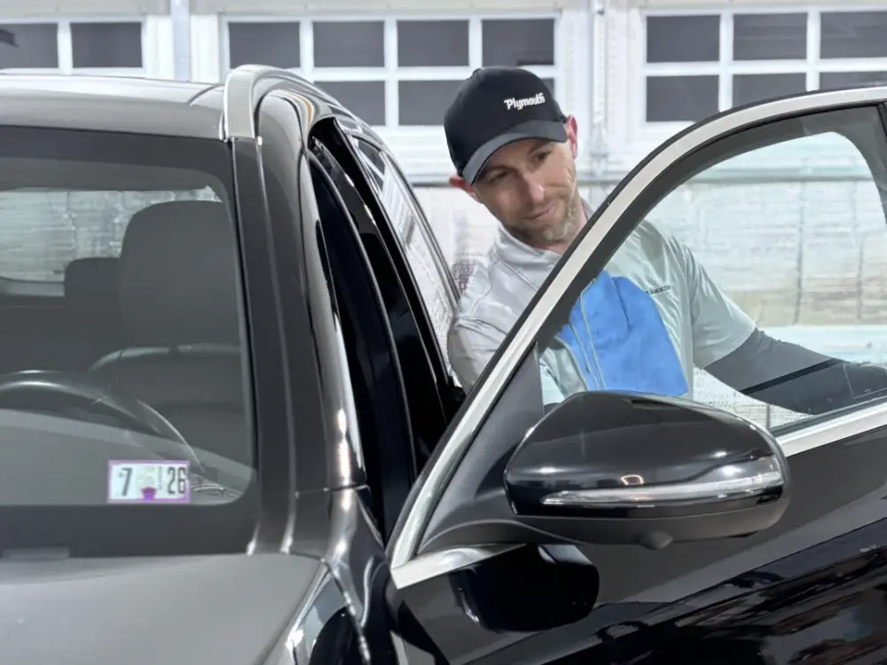 Jarrod Hillery, Owner of Mobile Makeovers - Detailing car interior door.